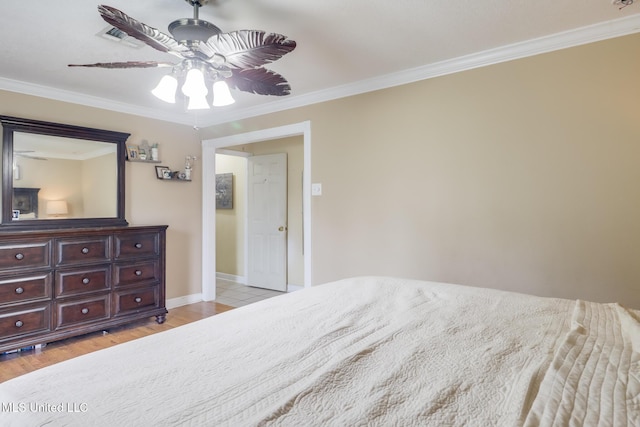 5421 Espy Ave, Long Beach, MS 39560 - bedroom with ornamental molding, light wood-style floors, and a ceiling fan