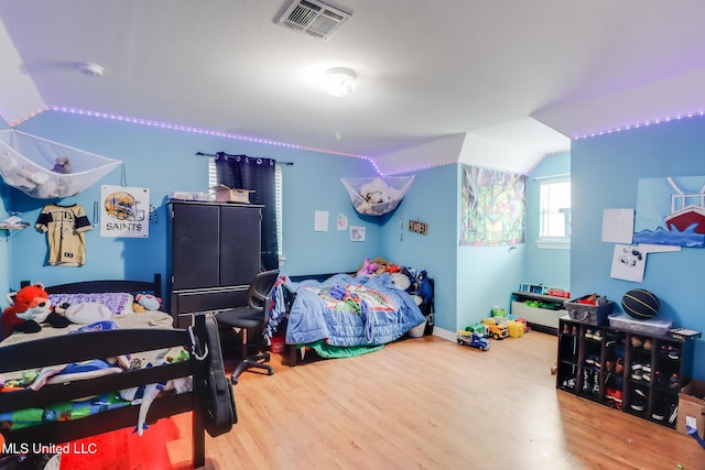 5421 Espy Ave, Long Beach, MS 39560 - bedroom with wood finished floors and lofted ceiling