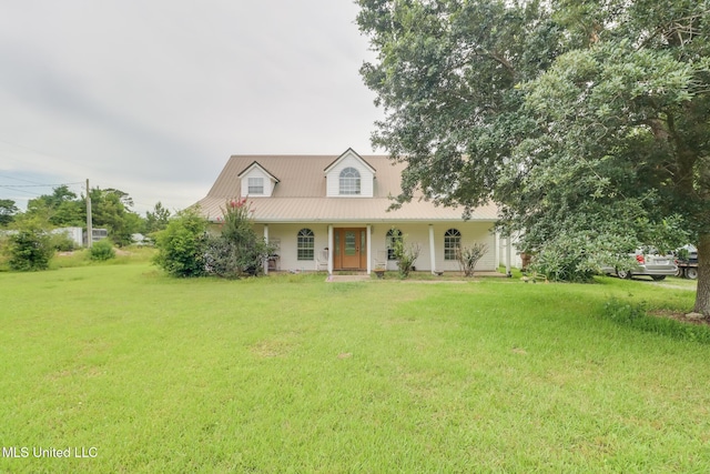 5421 Espy Ave, Long Beach, MS 39560 - cape cod house with covered porch, a front yard, and a metal roof