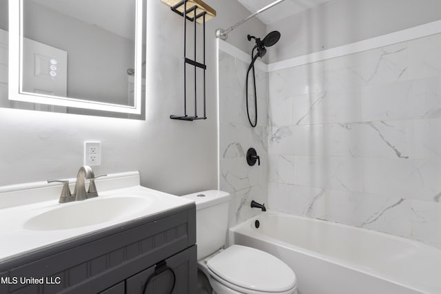 bathroom with tub / shower combination, vanity, and toilet