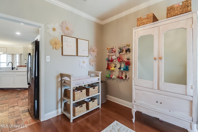 interior space featuring dark wood-type flooring and ornamental molding