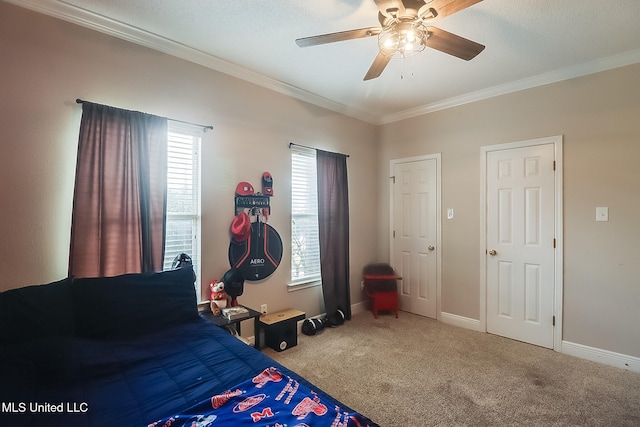 bedroom with crown molding, carpet flooring, and ceiling fan