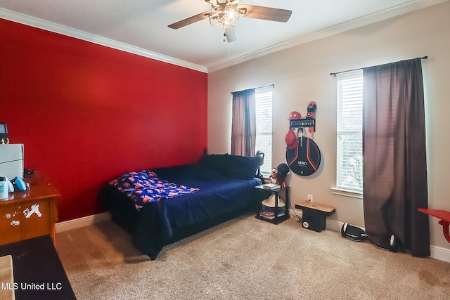 bedroom featuring ornamental molding, ceiling fan, and carpet flooring