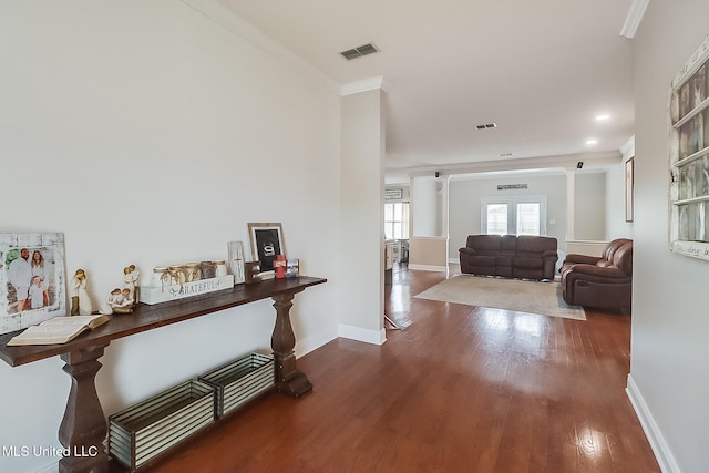 corridor featuring ornamental molding and wood-type flooring