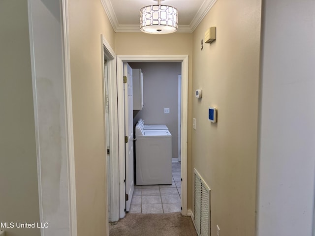 8004 Martin Bluff Rd, Gautier, MS 39553 - corridor with crown molding, light carpet, light tile patterned flooring, and washer and clothes dryer