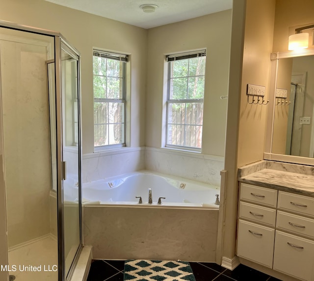 8004 Martin Bluff Rd, Gautier, MS 39553 - full bathroom featuring plenty of natural light, vanity, a shower stall, and a bath