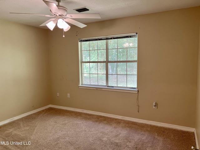 8004 Martin Bluff Rd, Gautier, MS 39553 - spare room featuring light colored carpet and a ceiling fan