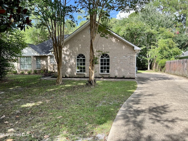 8004 Martin Bluff Rd, Gautier, MS 39553 - view of front of house featuring brick siding and asphalt driveway
