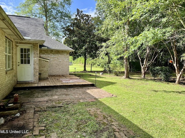 8004 Martin Bluff Rd, Gautier, MS 39553 - view of grassy yard with a deck