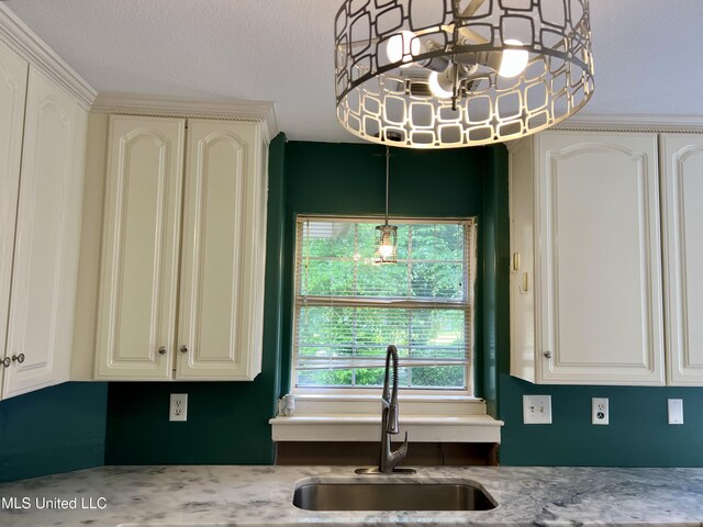 8004 Martin Bluff Rd, Gautier, MS 39553 - kitchen featuring white cabinets and hanging light fixtures
