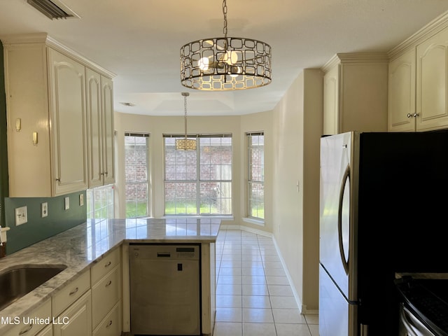 8004 Martin Bluff Rd, Gautier, MS 39553 - kitchen with dishwasher, a peninsula, light tile patterned floors, a chandelier, and freestanding refrigerator