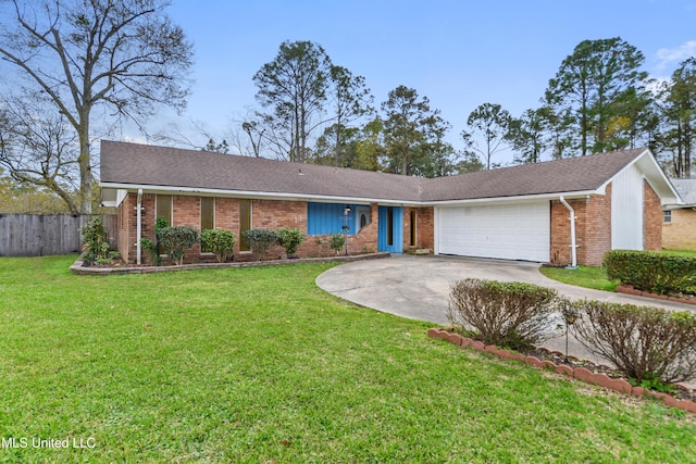 ranch-style house featuring a front yard, brick siding, a garage, and driveway