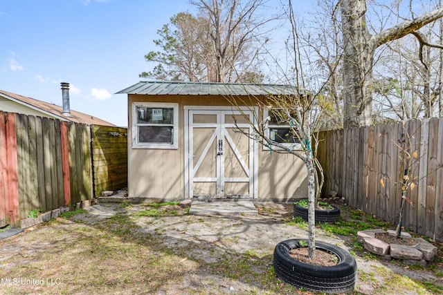 view of shed featuring a fenced backyard