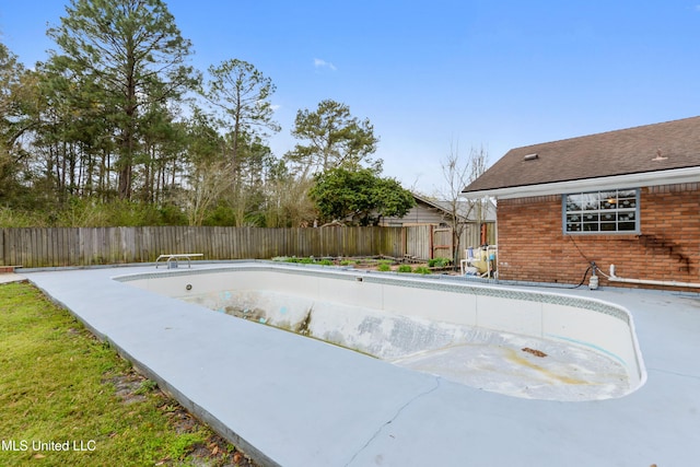 view of swimming pool with a patio area, a fenced in pool, and a fenced backyard