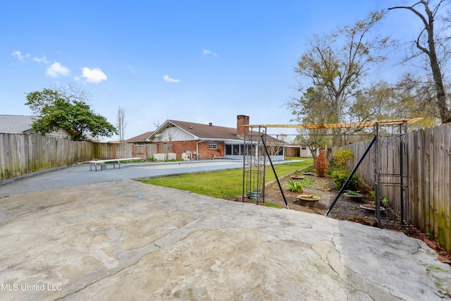 view of yard with a patio and a fenced backyard