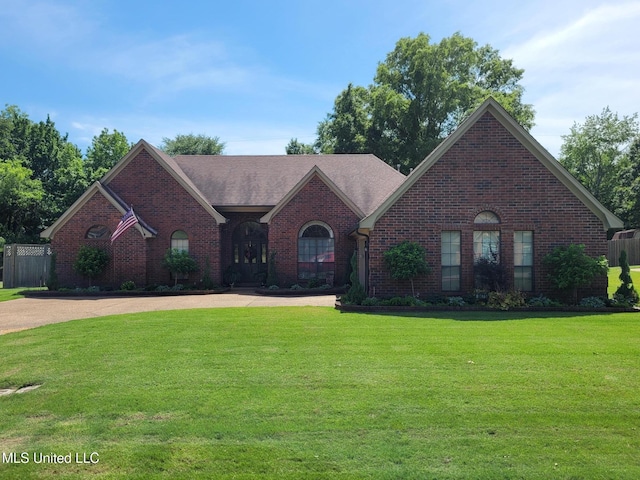 8475 Windersgate Dr, Olive Branch, MS 38654 - view of front of home with brick siding and a front lawn