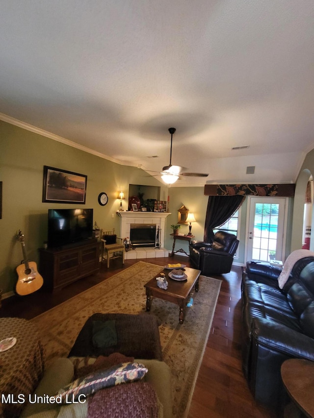 8475 Windersgate Dr, Olive Branch, MS 38654 - living room with crown molding, wood finished floors, ceiling fan, and a tile fireplace