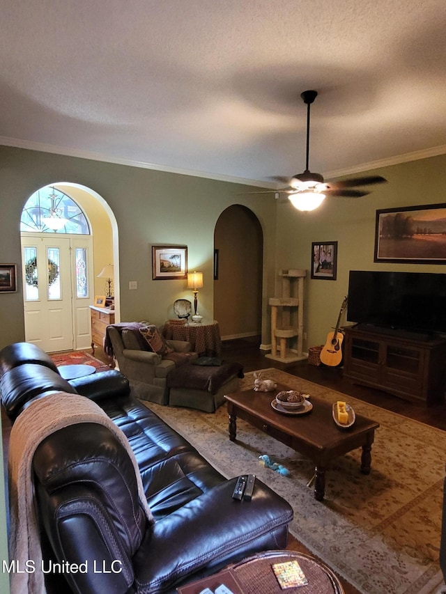 8475 Windersgate Dr, Olive Branch, MS 38654 - living room featuring arched walkways, ornamental molding, ceiling fan, and wood finished floors