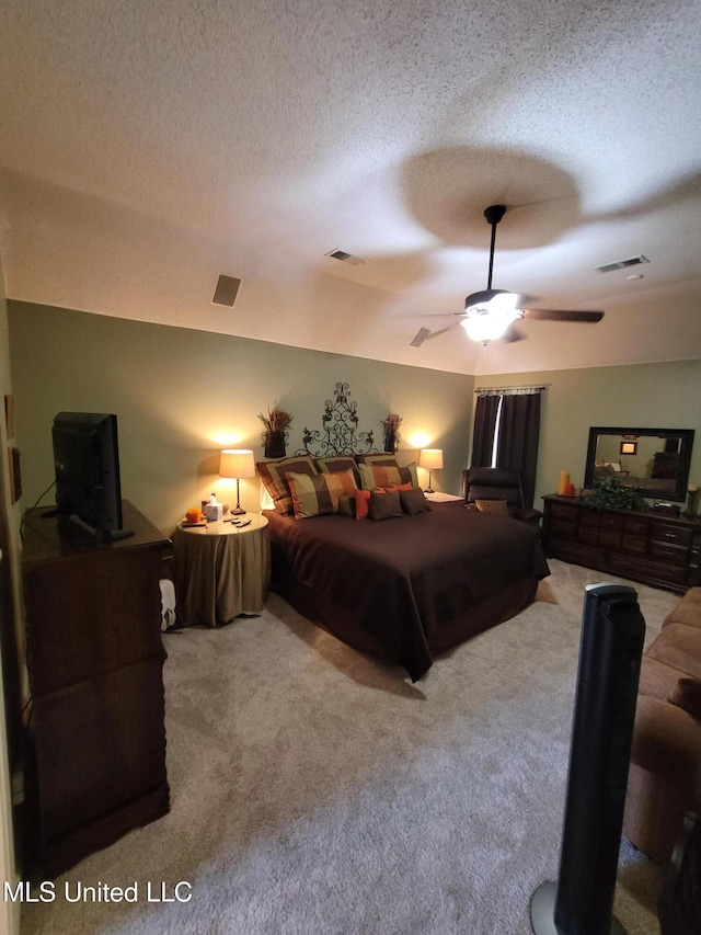 8475 Windersgate Dr, Olive Branch, MS 38654 - carpeted bedroom featuring a textured ceiling and ceiling fan