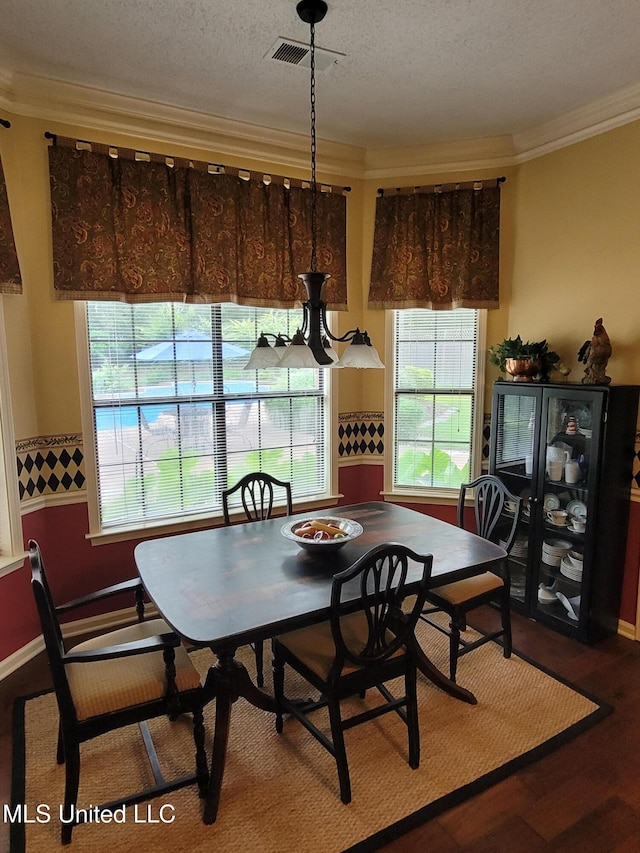 8475 Windersgate Dr, Olive Branch, MS 38654 - dining room featuring crown molding, plenty of natural light, wood finished floors, and a textured ceiling
