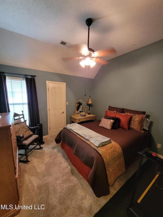 8475 Windersgate Dr, Olive Branch, MS 38654 - bedroom with light carpet, a textured ceiling, vaulted ceiling, ceiling fan, and baseboards