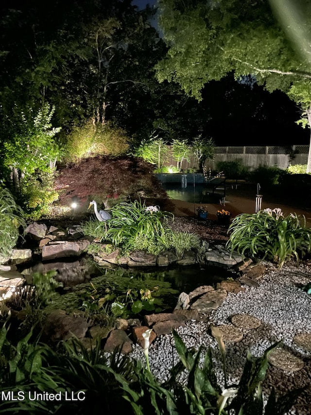 8475 Windersgate Dr, Olive Branch, MS 38654 - view of yard featuring a garden pond
