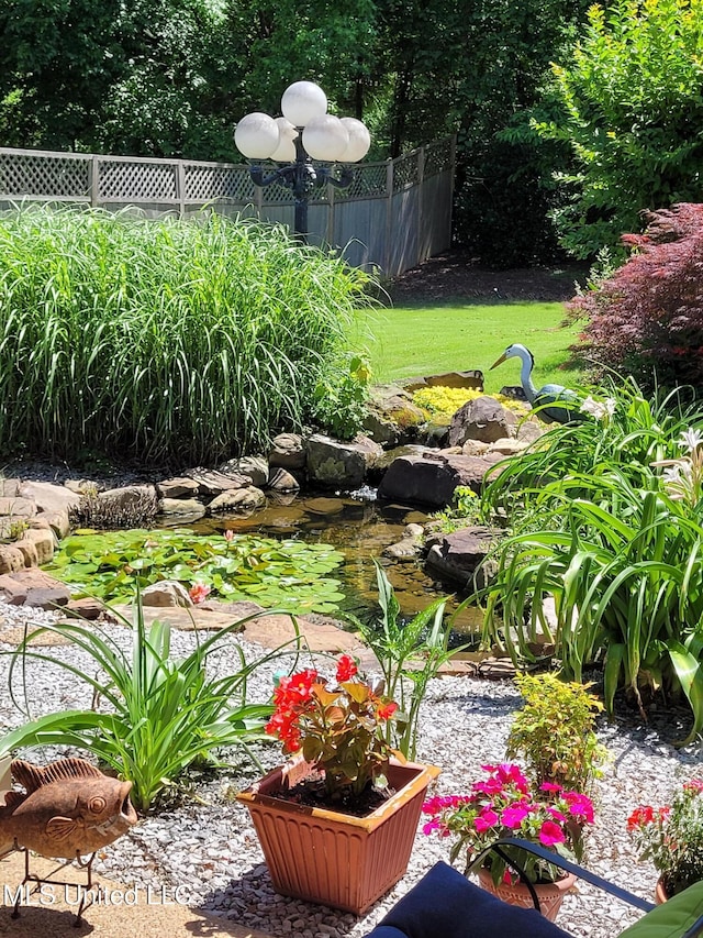 8475 Windersgate Dr, Olive Branch, MS 38654 - view of yard with a garden pond