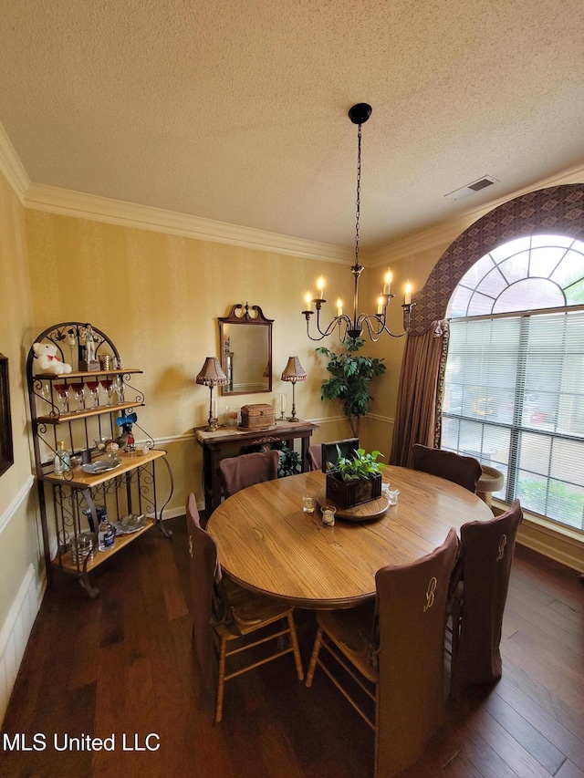 8475 Windersgate Dr, Olive Branch, MS 38654 - dining room featuring a chandelier, hardwood / wood-style flooring, a textured ceiling, and crown molding
