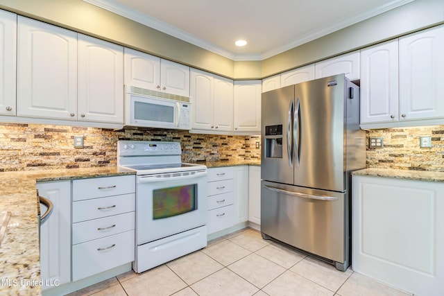 kitchen with backsplash, white cabinetry, light stone countertops, crown molding, and white appliances