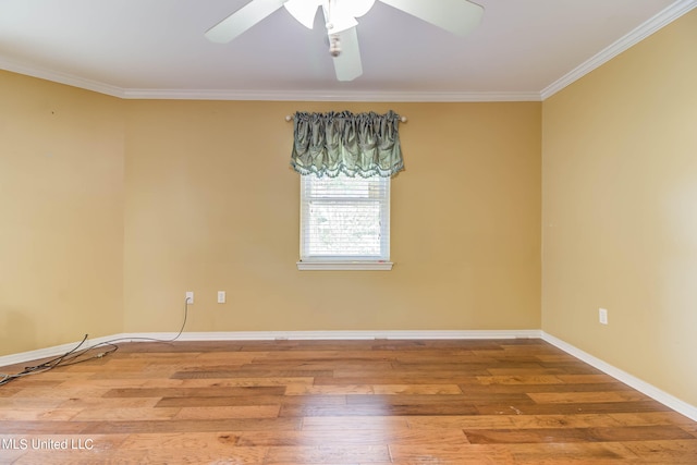 empty room with crown molding, hardwood / wood-style flooring, and ceiling fan