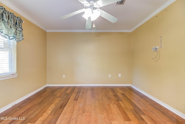 spare room with ceiling fan, ornamental molding, and light wood-type flooring