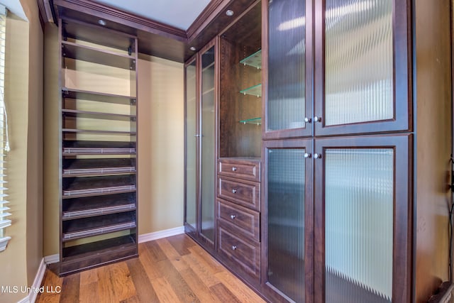 spacious closet featuring hardwood / wood-style floors