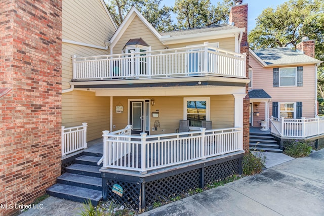 view of front facade with a balcony