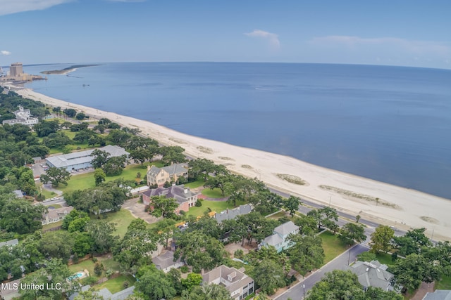 drone / aerial view featuring a water view and a beach view