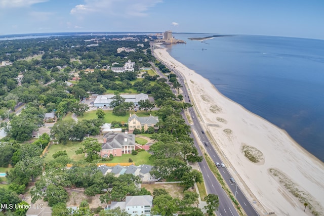 birds eye view of property with a view of the beach and a water view