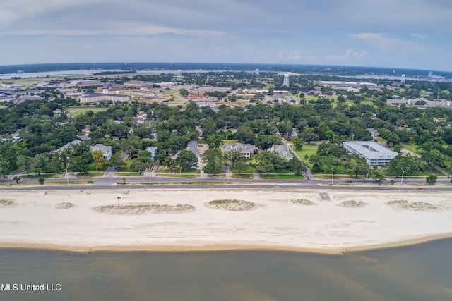 bird's eye view with a water view and a beach view