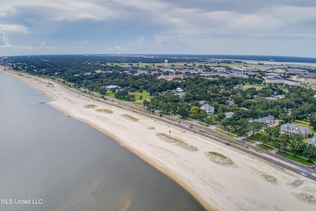 bird's eye view with a water view and a beach view