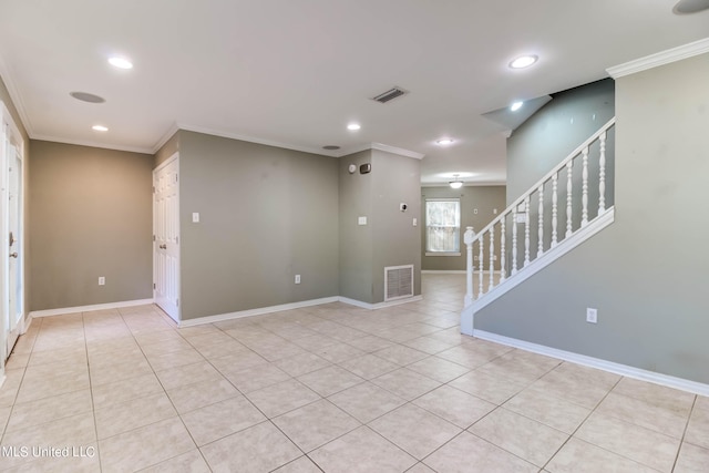 unfurnished room featuring crown molding and light tile patterned flooring