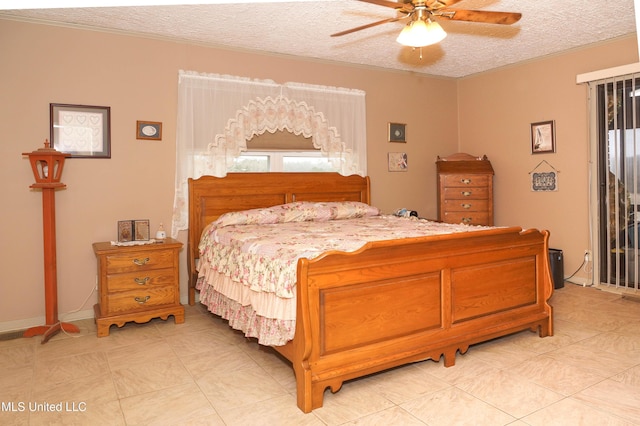 tiled bedroom featuring multiple windows, ceiling fan, and a textured ceiling