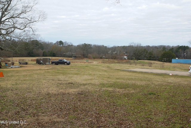 view of yard with a rural view