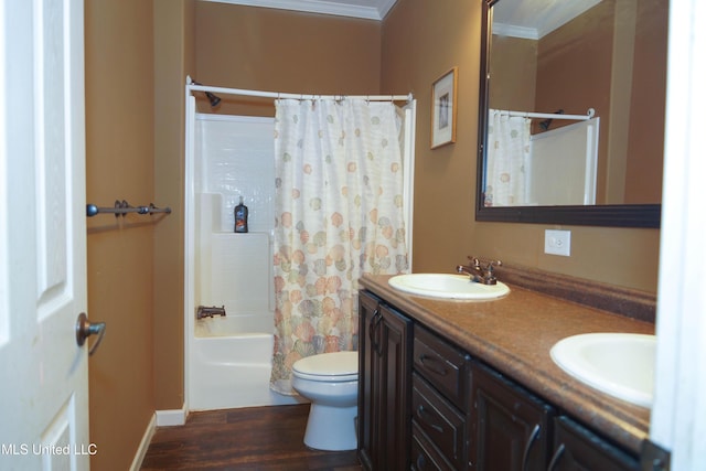 full bathroom with ornamental molding, vanity, shower / bath combo with shower curtain, wood-type flooring, and toilet