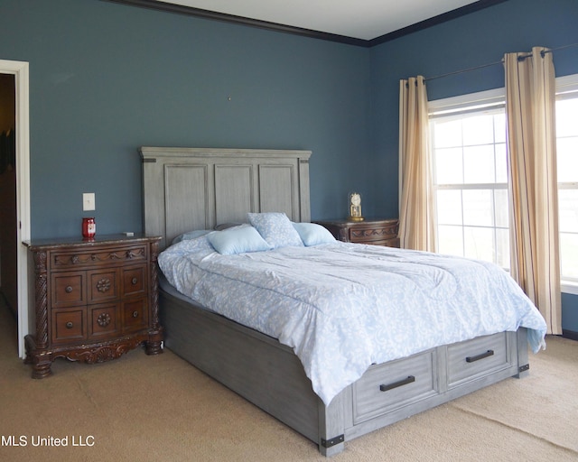 bedroom with light carpet and ornamental molding