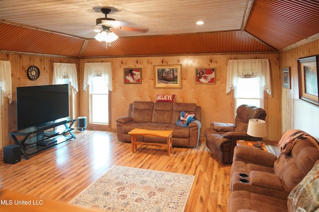 living room with wood ceiling, ceiling fan, crown molding, light hardwood / wood-style floors, and lofted ceiling