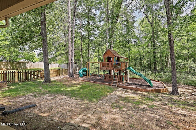 view of jungle gym featuring fence