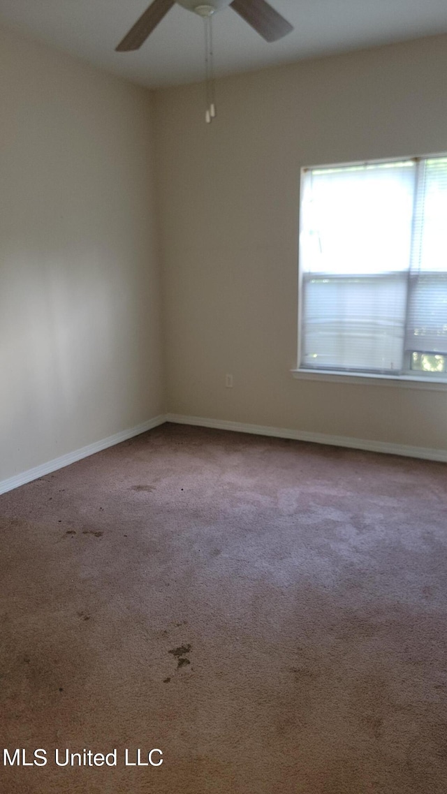 unfurnished room featuring carpet flooring and ceiling fan