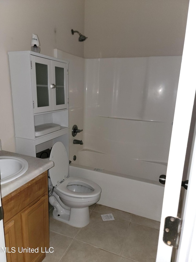 full bathroom with vanity, tub / shower combination, toilet, and tile patterned floors