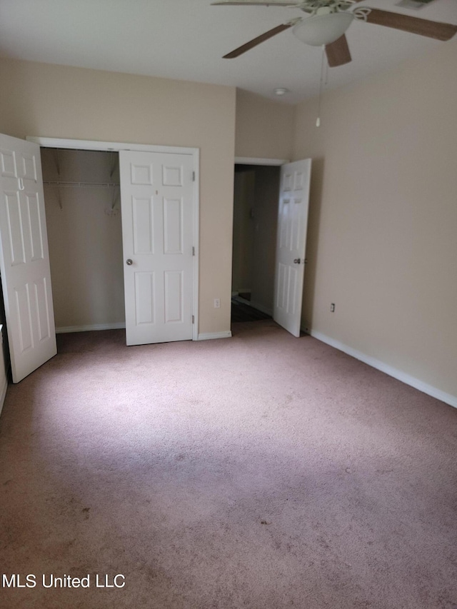 unfurnished bedroom with a closet, ceiling fan, and light carpet