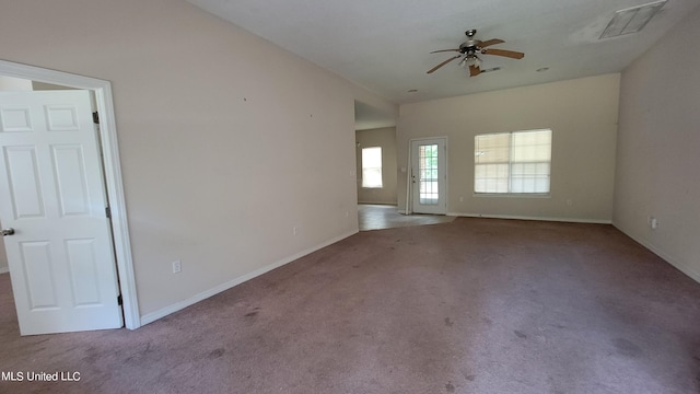 carpeted spare room with ceiling fan