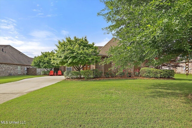 510 Belle Oak Pl, Brandon, MS 39042 - view of green lawn with concrete driveway