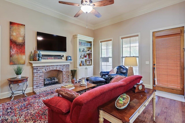 510 Belle Oak Pl, Brandon, MS 39042 - living room with wood finished floors, a ceiling fan, ornamental molding, a brick fireplace, and baseboards